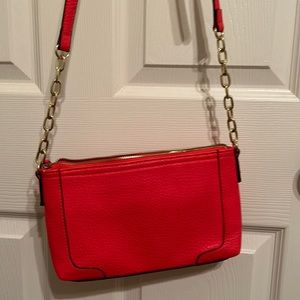 Used, but like new Merona purse, and has 3 pockets with adjustable strap.